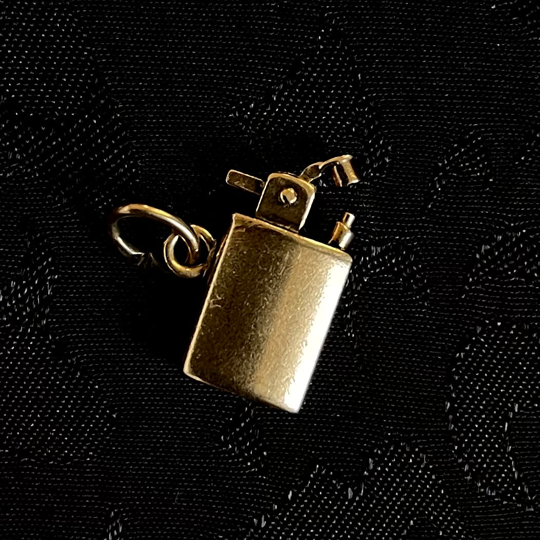 The Solid Gold Kinetic Lighter Charm